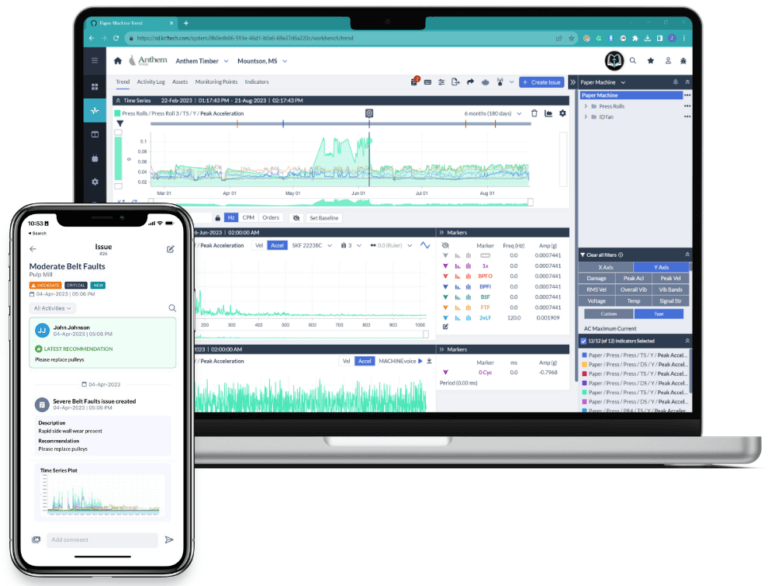 Two screens show information for machine health monitoring of cranes on a laptop and smart phone.