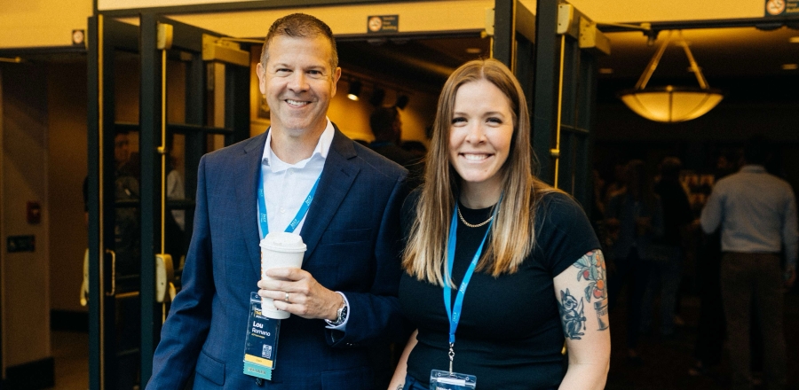 KCF team members smiling at a conference.