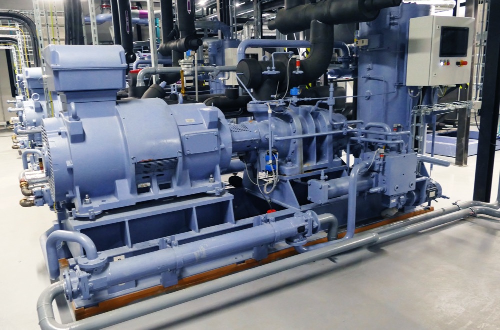 Ammonia compressors on a production floor.
