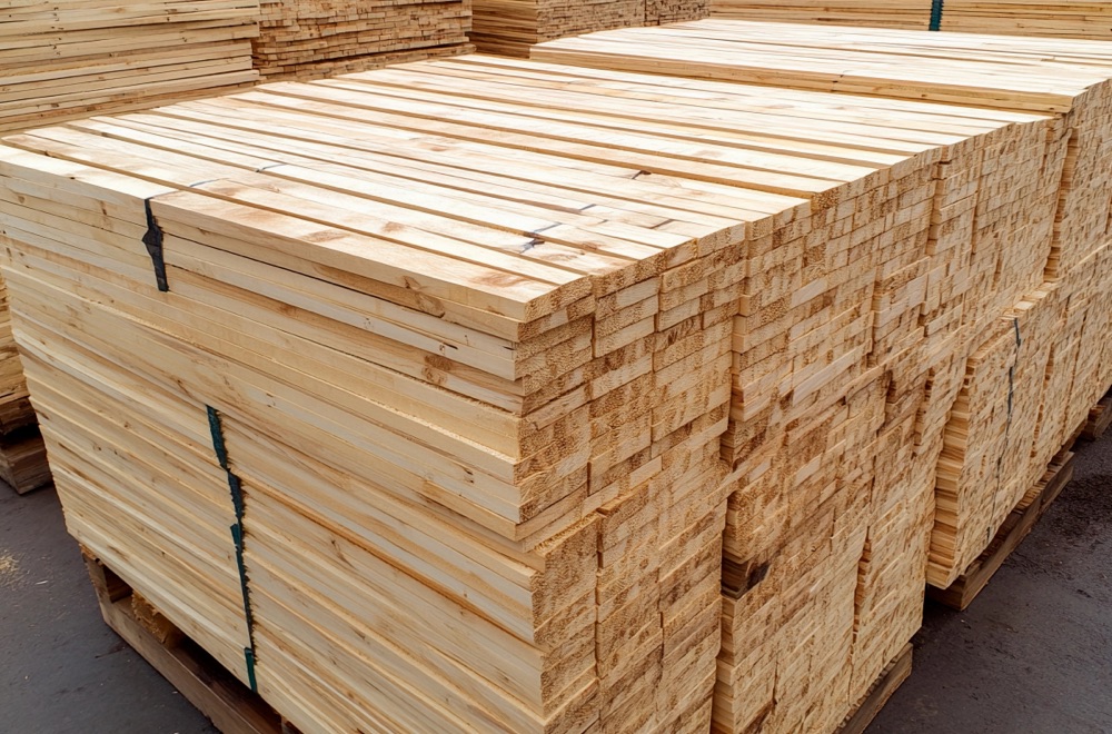 Forest products industry photo showing lumber stacked up on pallets.
