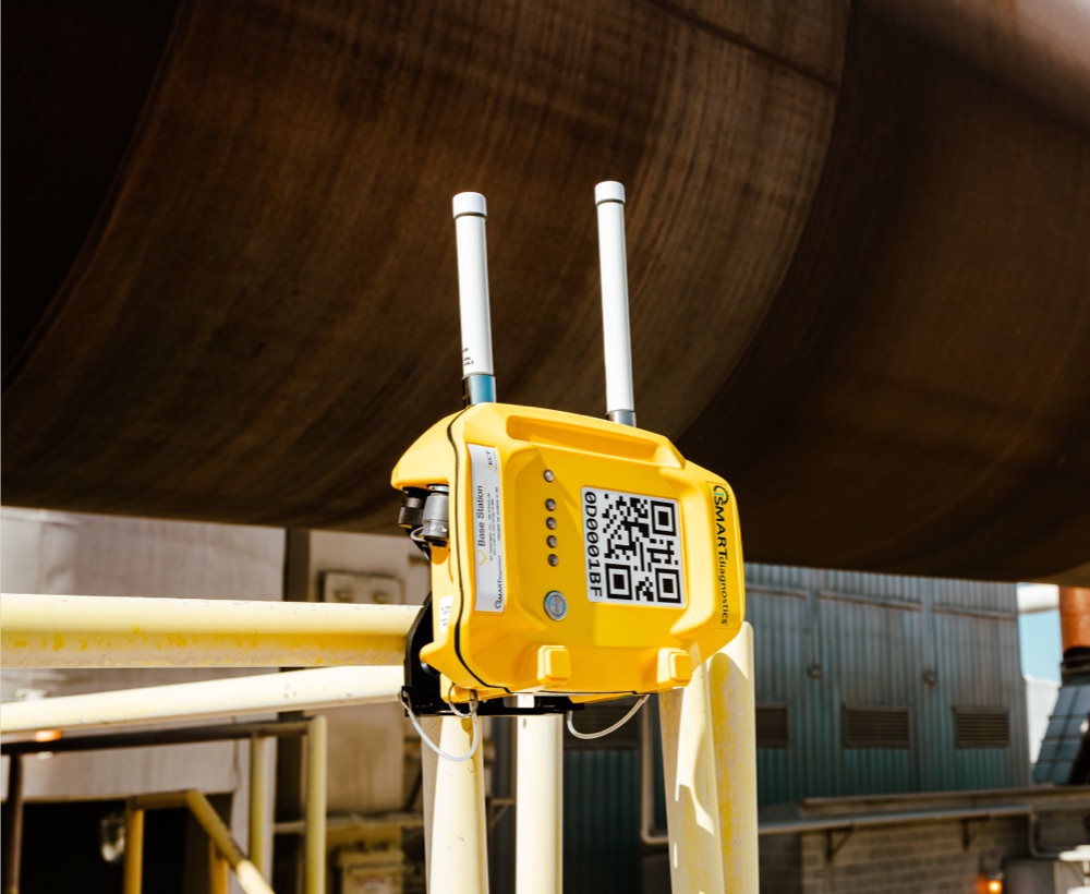 Bright yellow SMARTsensing base station unit on site.