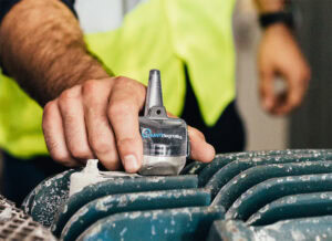 KCF technician places a vibration monitor for machine health and preventive maintenace of a top drive motor.