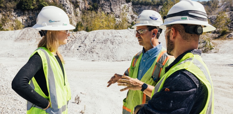 Engineers discuss SENTRYsolutions on site in a rugged and remote area.