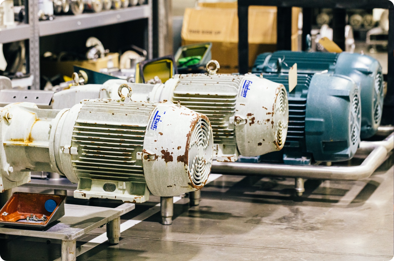 Motors lined up on maintenance shelves ready for predictive maintenance steps.