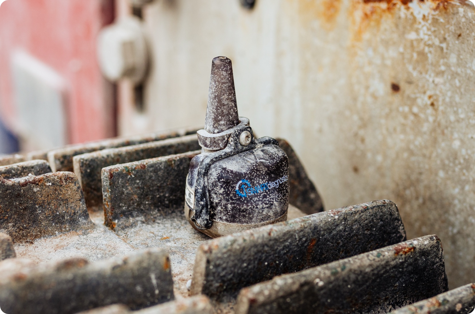 Rugged and reliable, the black and silver SMARTdiagnostics vibration sensor protects machinery despite dirt and grime, working well in any location.