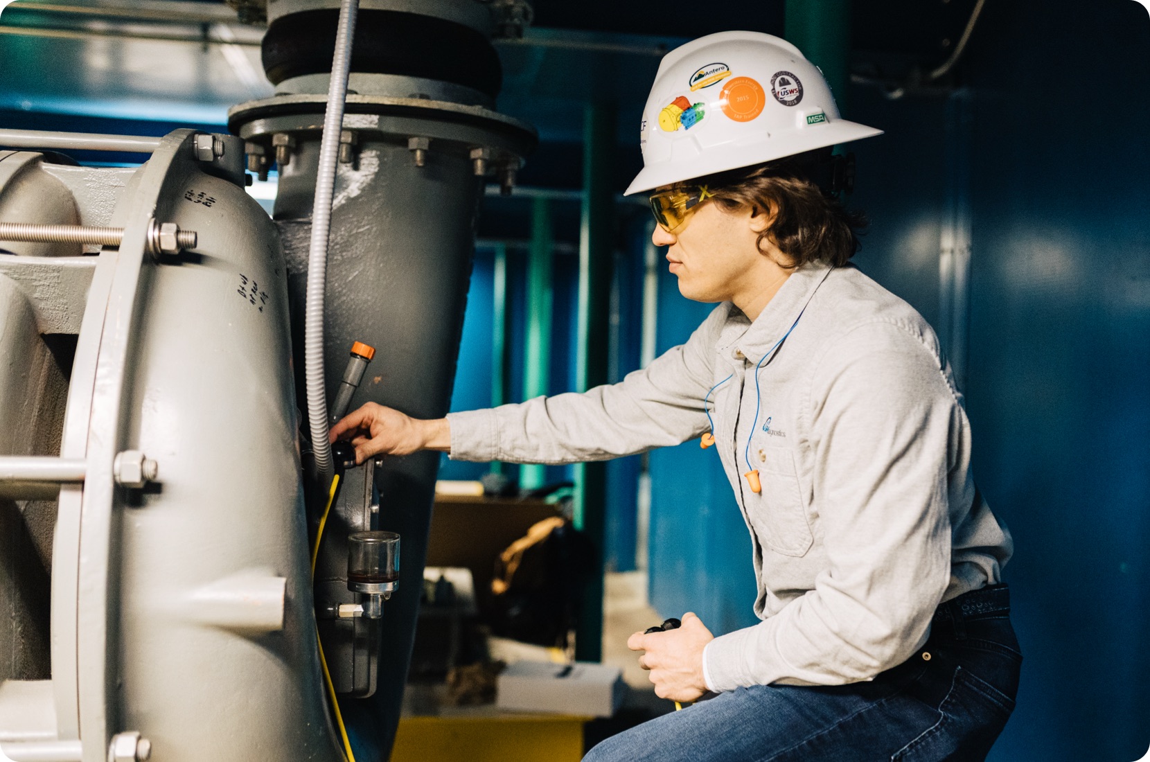 KCF technician installs remote vibration monitoring on equipment.