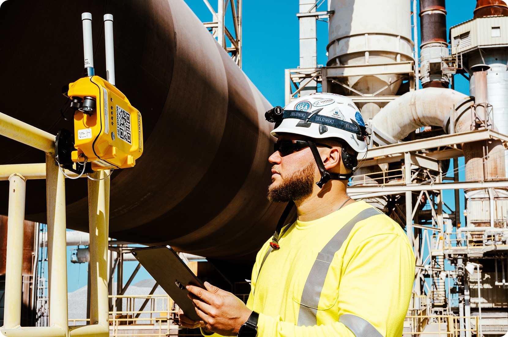 SMARTsensing parent unit being checked by an engineer in a remote mining location for predictive maintenance.