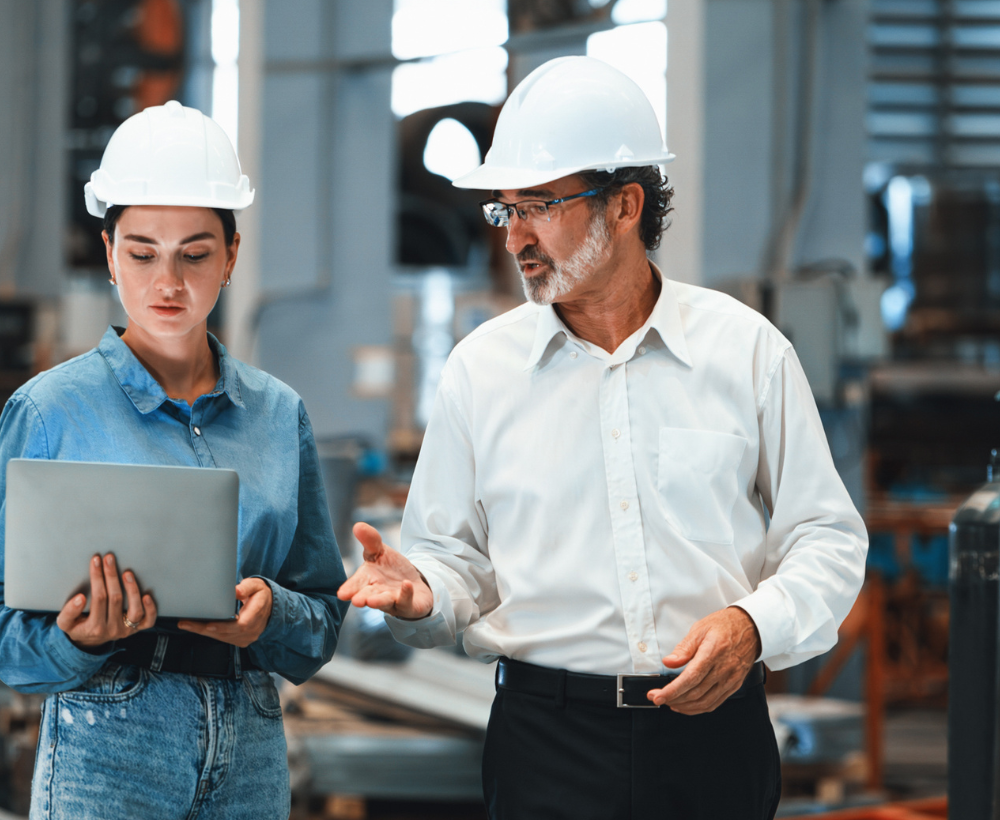 corporate leader executive touring manufacturing plant