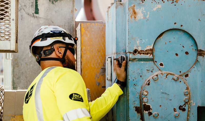 maintenance professional adding a vibration sensor to machinery